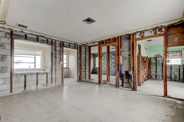 a view of a room with gym equipment and a large window
