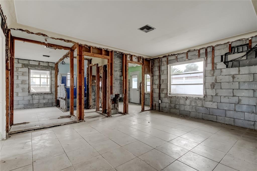 245 145th Avenue Madeira Beach, FL 33708 - Photo 25 of 41 a view of a room with gym equipment and a large window