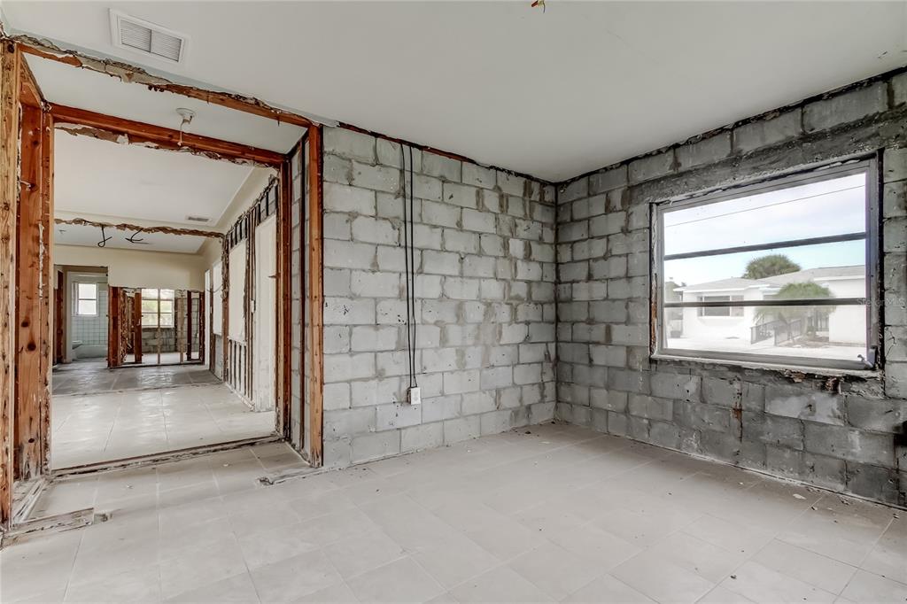 245 145th Avenue Madeira Beach, FL 33708 - Photo 26 of 37 an empty room with windows