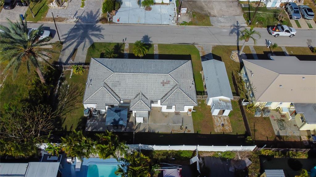 245 145th Avenue Madeira Beach, FL 33708 - Photo 3 of 41 an aerial view of a house with a yard