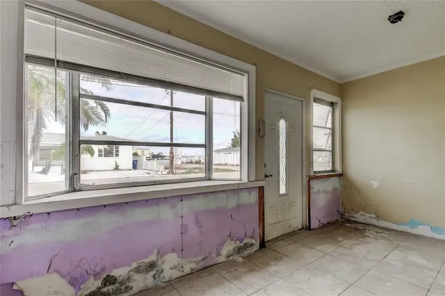 a view of an empty room with stairs