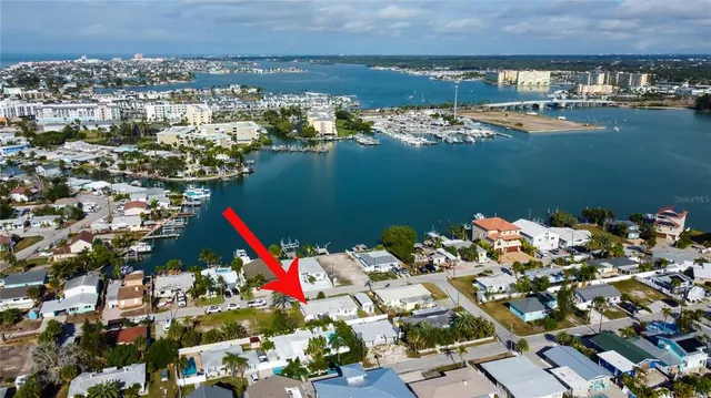 an aerial view of a house with a lake view