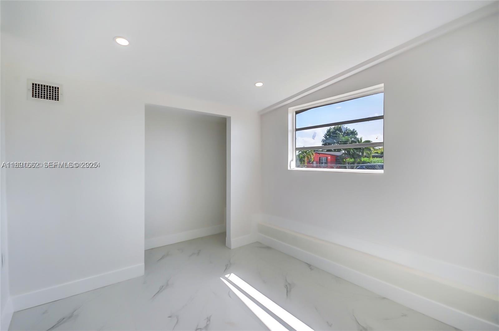 14465 Southwest 290th Terrace Homestead, FL 33033 - Photo 11 of 31 a view of hallway with window