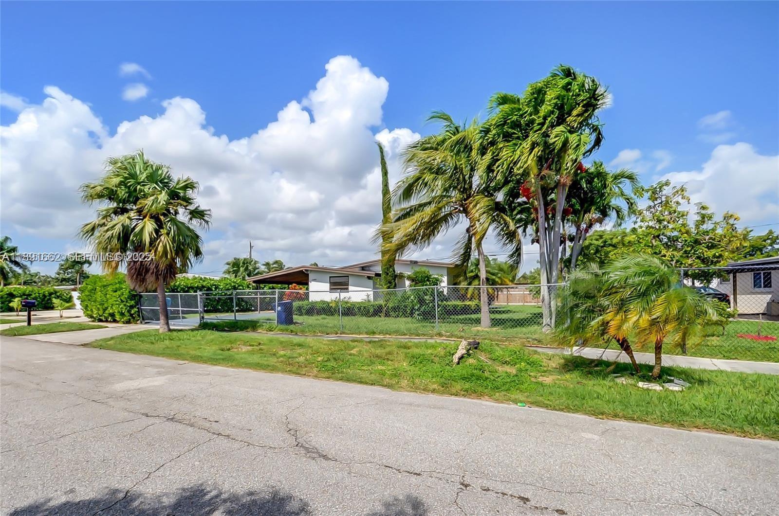 14465 Southwest 290th Terrace Homestead, FL 33033 - Photo 13 of 31 a view of a park with palm trees