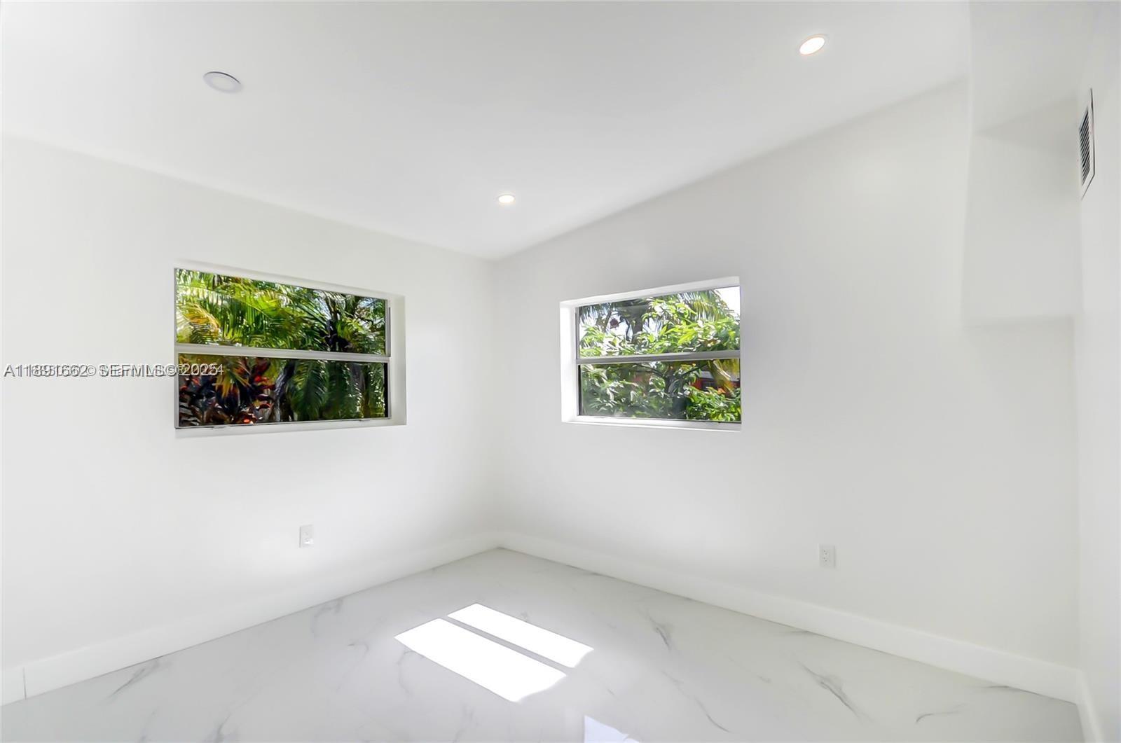 14465 Southwest 290th Terrace Homestead, FL 33033 - Photo 14 of 31 an empty room with windows