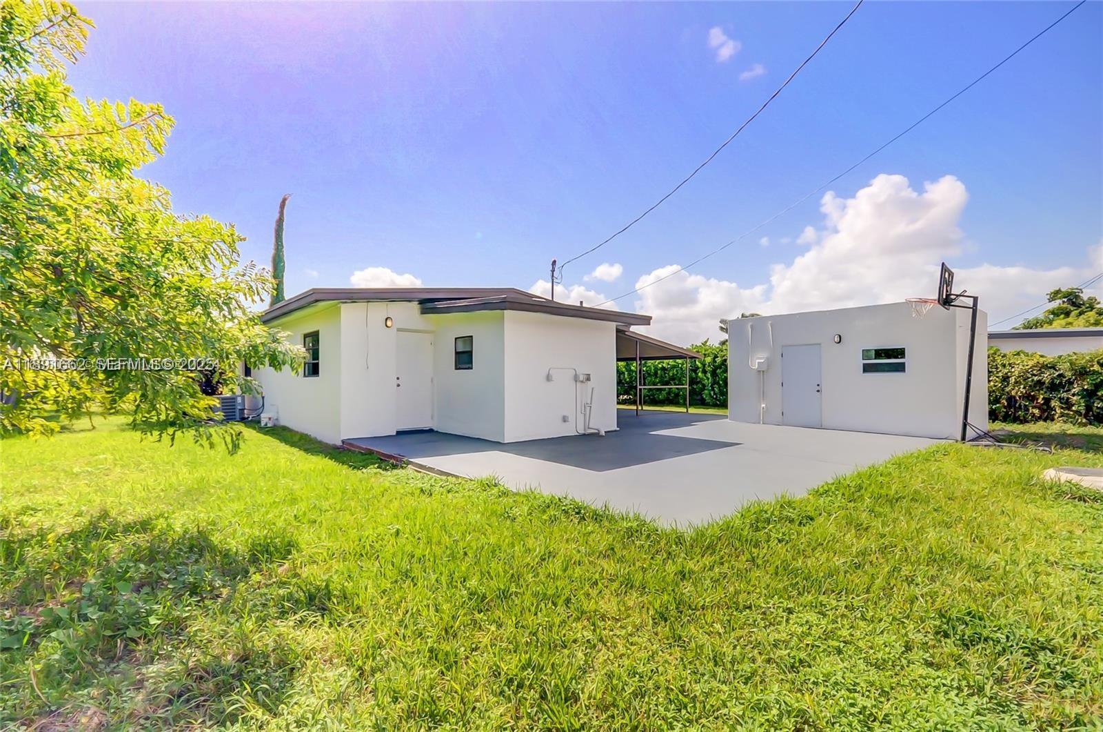 14465 Southwest 290th Terrace Homestead, FL 33033 - Photo 17 of 31 a house view with a backyard space