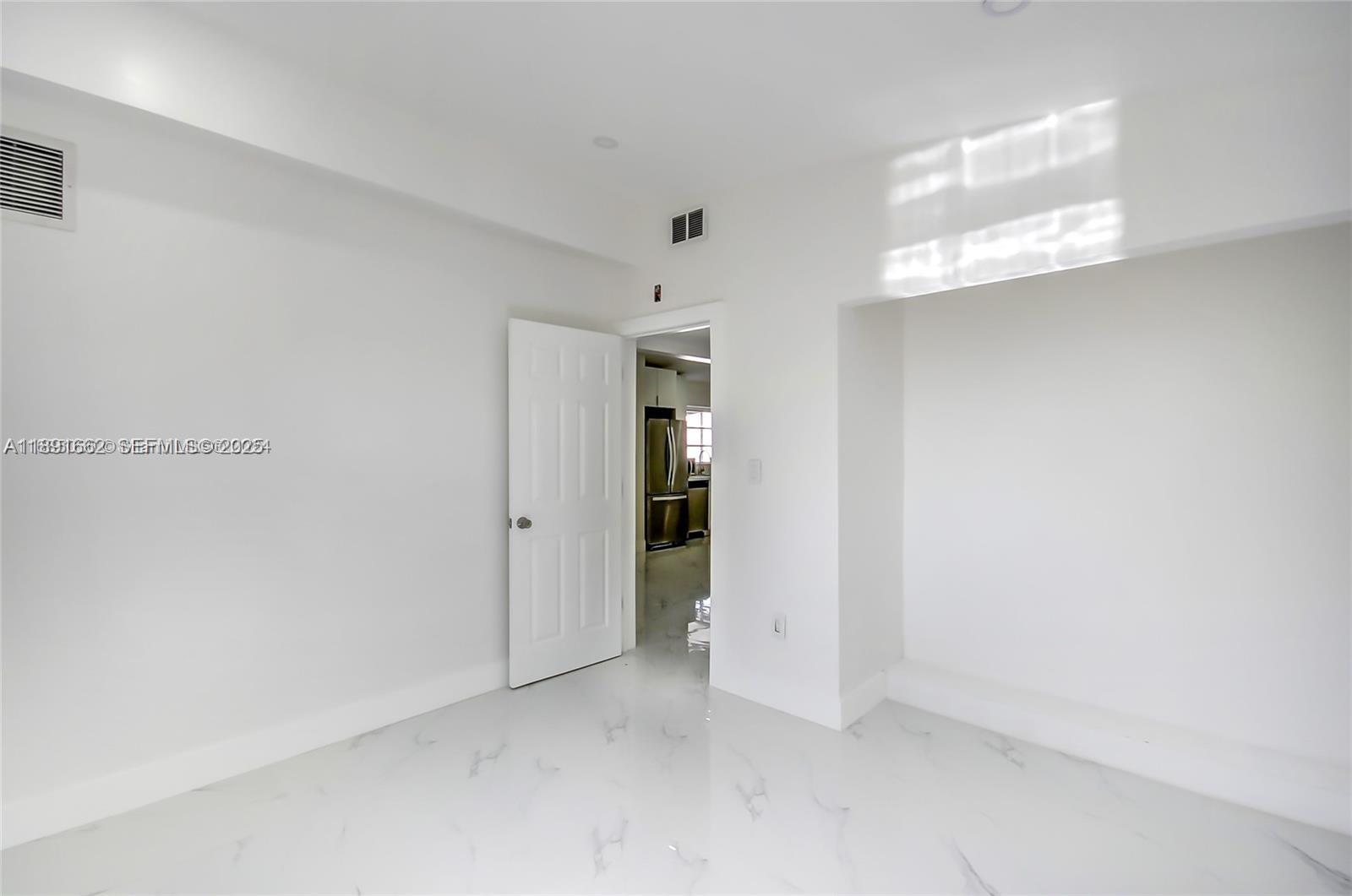 14465 Southwest 290th Terrace Homestead, FL 33033 - Photo 19 of 31 an empty room with an entryway