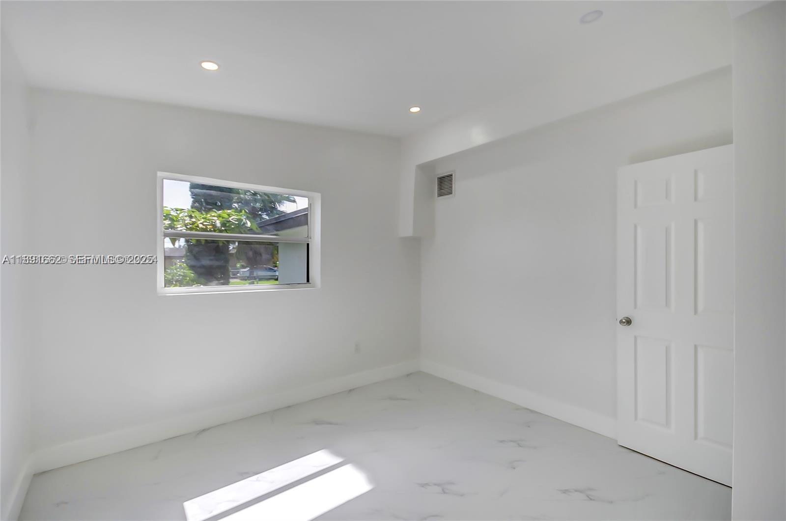 14465 Southwest 290th Terrace Homestead, FL 33033 - Photo 20 of 31 a view of room with window and hallway