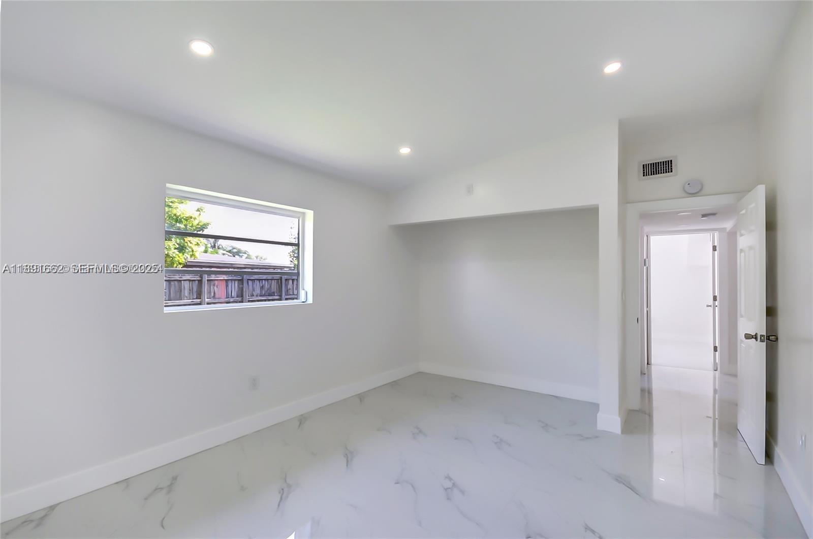 14465 Southwest 290th Terrace Homestead, FL 33033 - Photo 21 of 31 an empty room with windows and closet