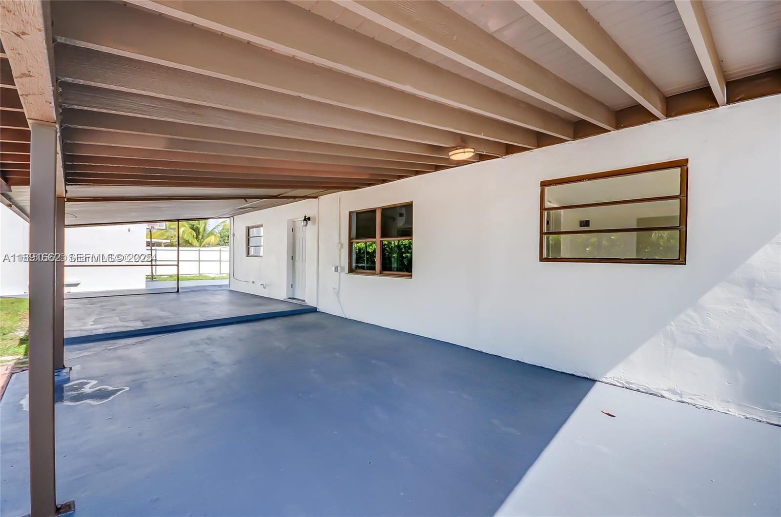 14465 Southwest 290th Terrace Homestead, FL 33033 - Photo 25 of 31 a view of an empty room with a window