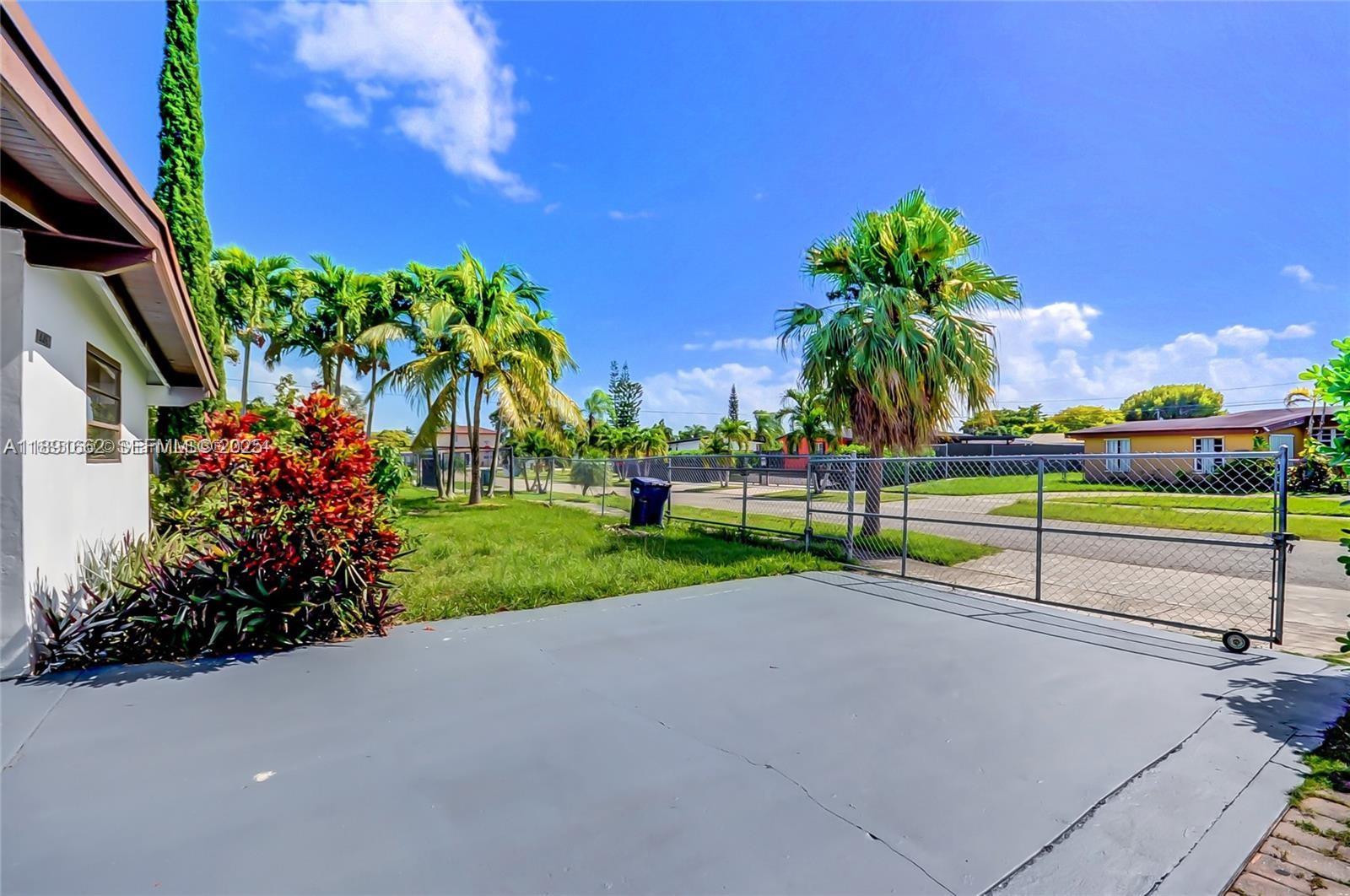 14465 Southwest 290th Terrace Homestead, FL 33033 - Photo 26 of 31 a view of green field with sitting area