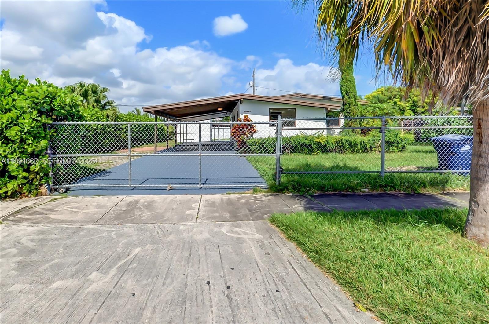 14465 Southwest 290th Terrace Homestead, FL 33033 - Photo 28 of 31 a front view of house with yard and green space
