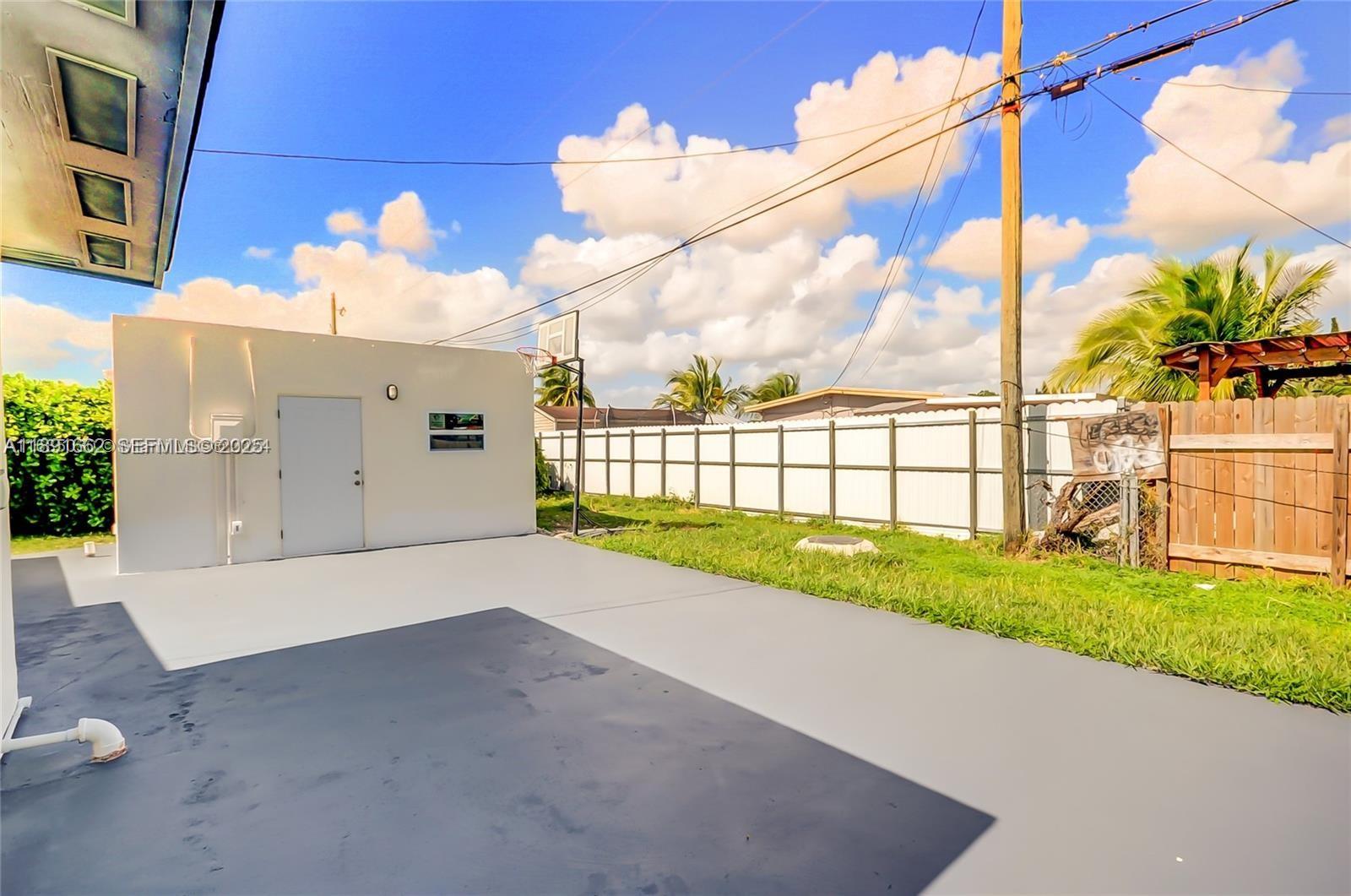 14465 Southwest 290th Terrace Homestead, FL 33033 - Photo 29 of 31 a view of a garden with a building