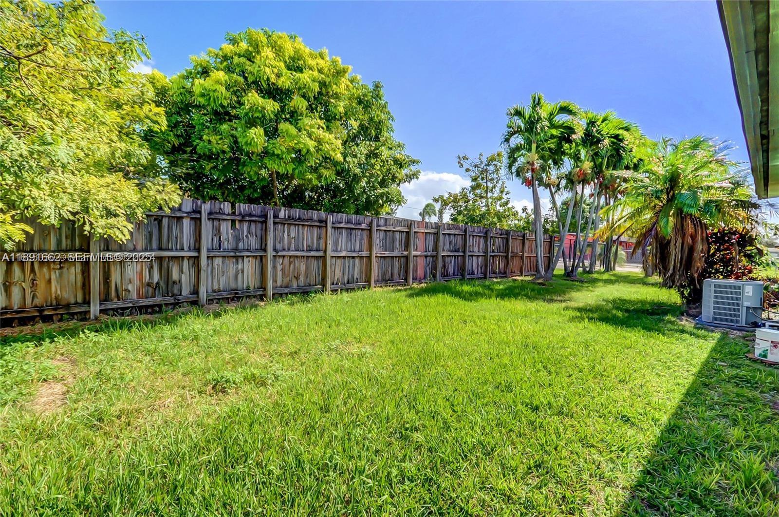 14465 Southwest 290th Terrace Homestead, FL 33033 - Photo 30 of 31 a view of a yard with a large trees