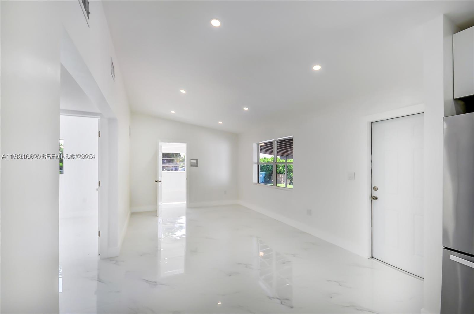 14465 Southwest 290th Terrace Homestead, FL 33033 - Photo 4 of 31 a view of empty room with wooden floor