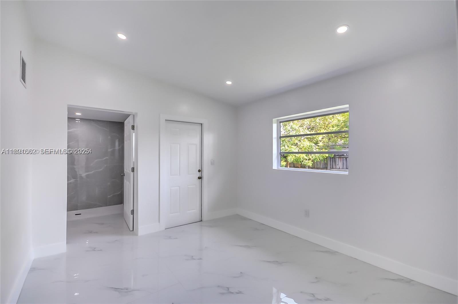 14465 Southwest 290th Terrace Homestead, FL 33033 - Photo 9 of 31 a view of an empty room