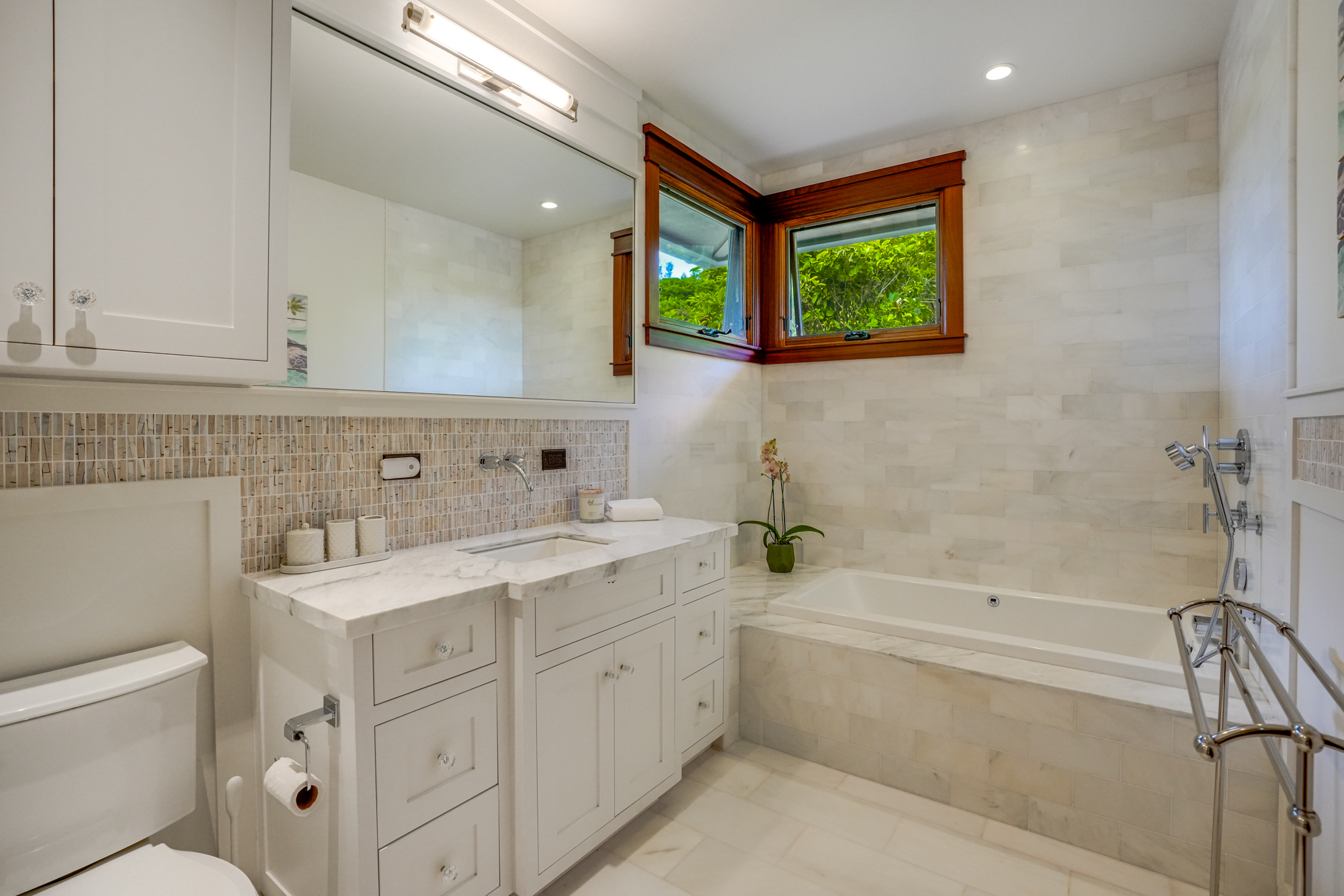 2332 Makana Ano Place Kilauea, HI 96754 - Photo 20 of 30 a bathroom with a double vanity sink a toilet and a bathtub