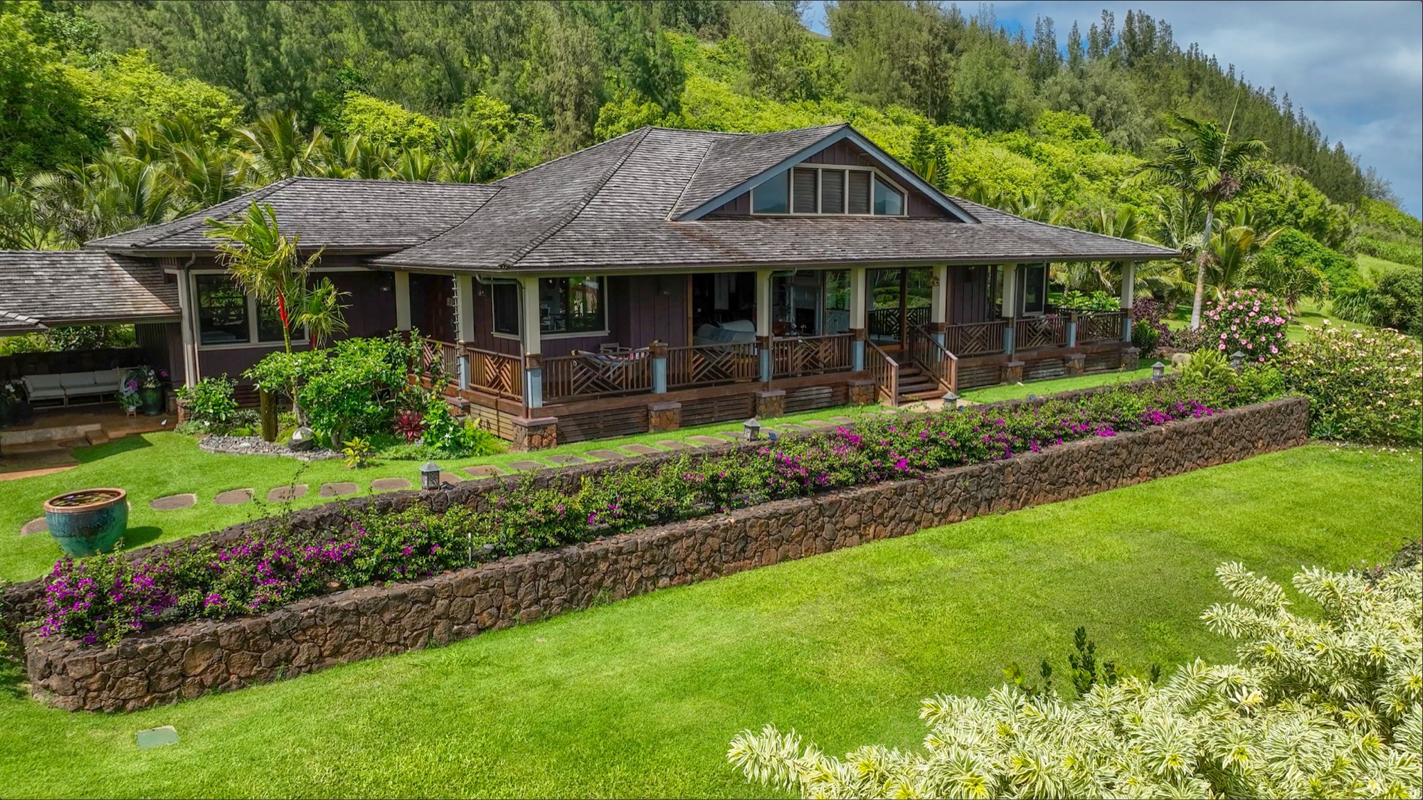 2332 Makana Ano Place Kilauea, HI 96754 - Photo 25 of 30 a front view of a house with a yard table and chairs