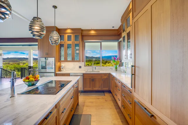 a kitchen with stainless steel appliances granite countertop a sink and counter space