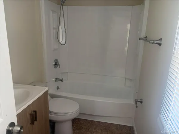 a bathroom with a sink a toilet and a bathtub