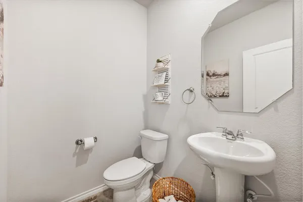 a bathroom with a granite countertop shower a sink and a mirror