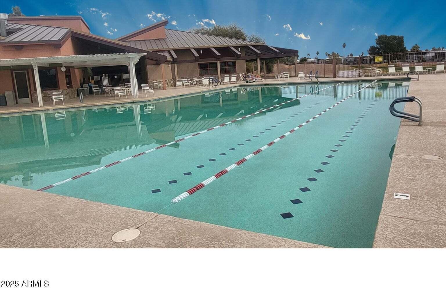 17200 West Bell Road, Unit 712 Surprise, AZ 85374 - Photo 17 of 19 a front view of a house with a garden