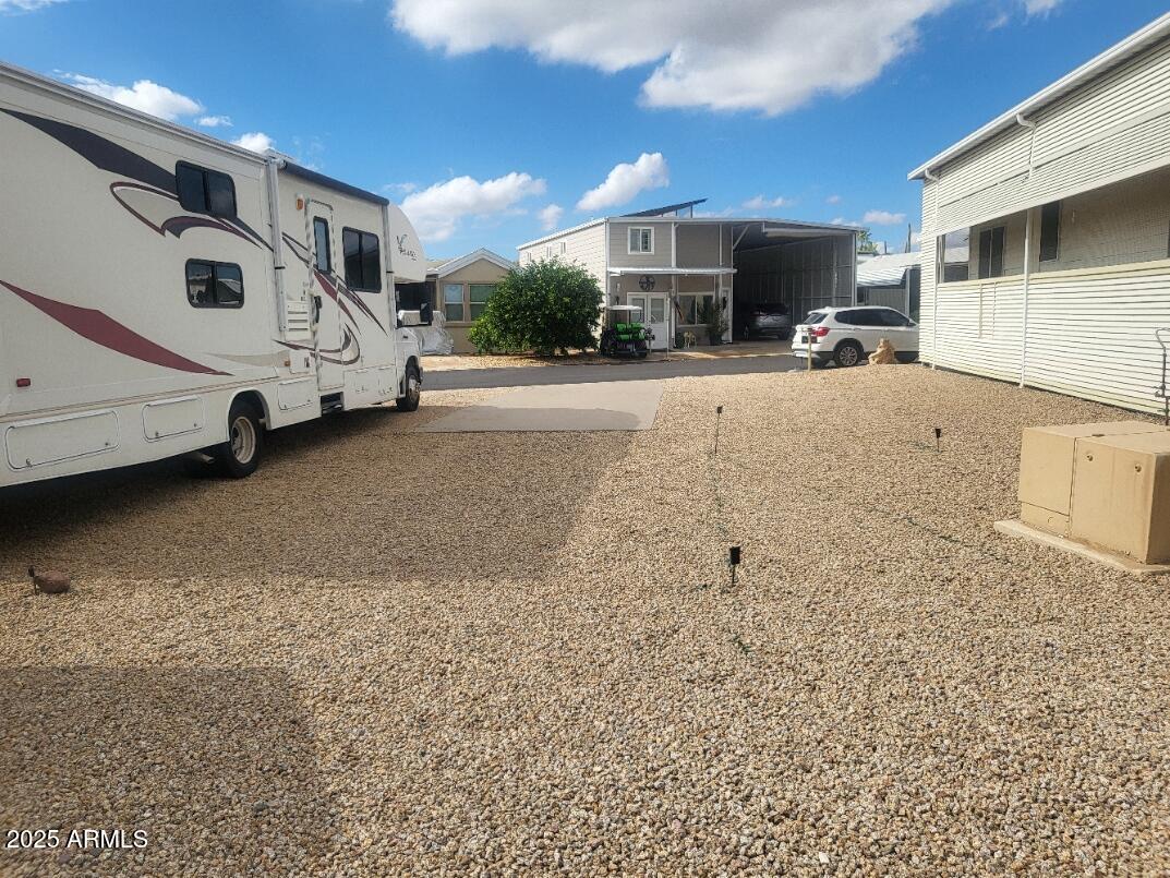17200 West Bell Road, Unit 712 Surprise, AZ 85374 - Photo 2 of 19 a view of a parking space with car parked