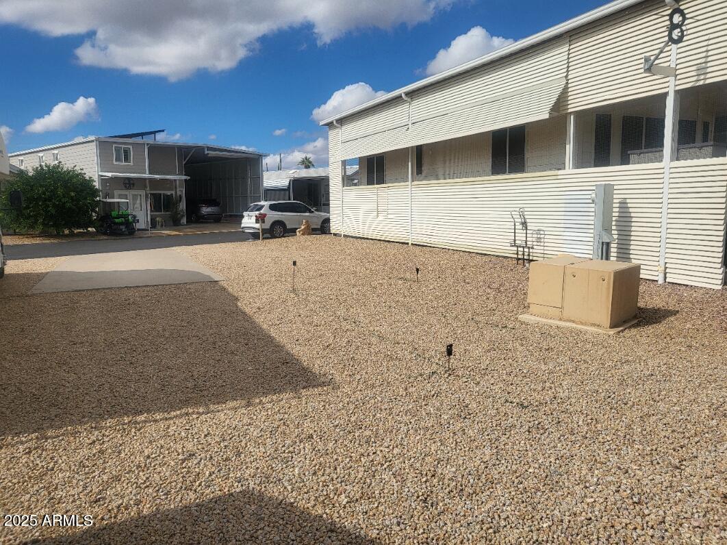 17200 West Bell Road, Unit 712 Surprise, AZ 85374 - Photo 3 of 19 a view of a house with a yard