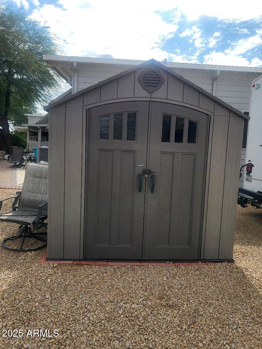 17200 West Bell Road, Unit 712 Surprise, AZ 85374 - Photo 6 of 19 a house with a wooden fence