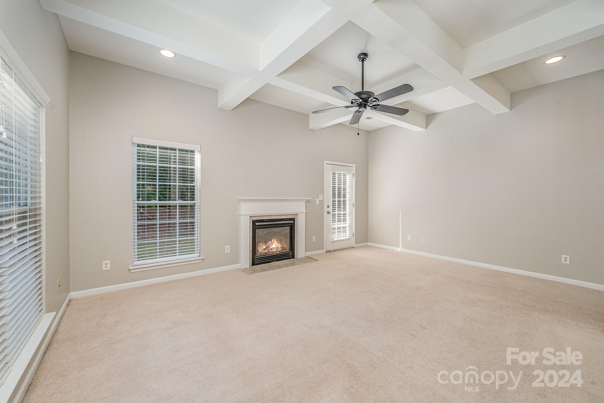 13341 Meadowmere Road Huntersville, NC 28078 - Photo 4 of 22 a view of an empty room with a fireplace