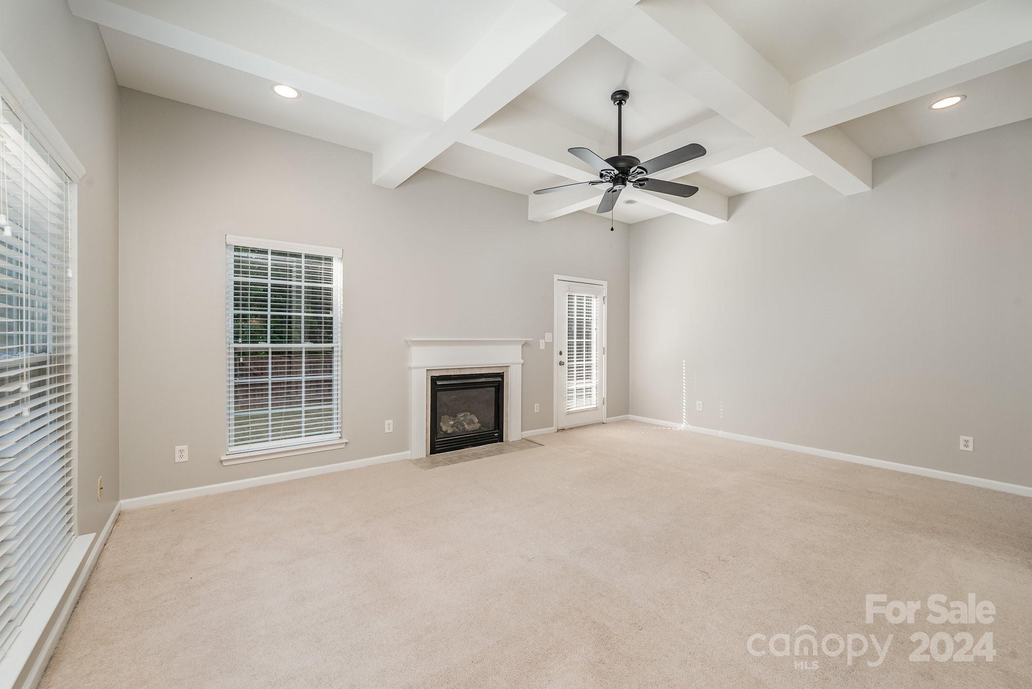 13341 Meadowmere Road Huntersville, NC 28078 - Photo 5 of 22 a view of an empty room with a fireplace