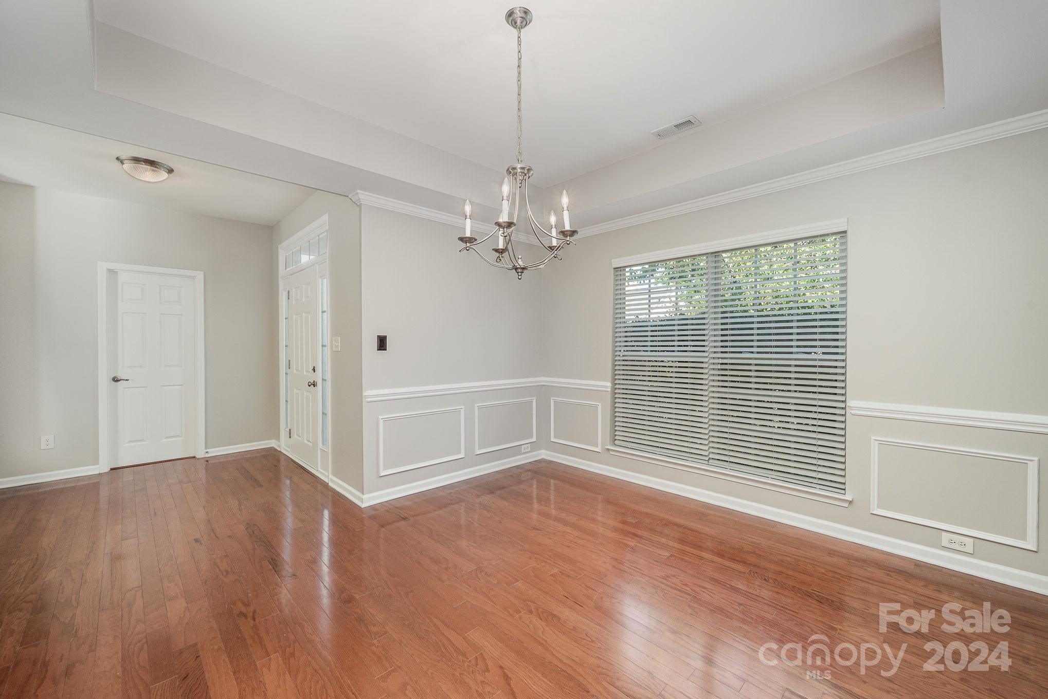 13341 Meadowmere Road Huntersville, NC 28078 - Photo 8 of 22 wooden floor in an empty room with a window