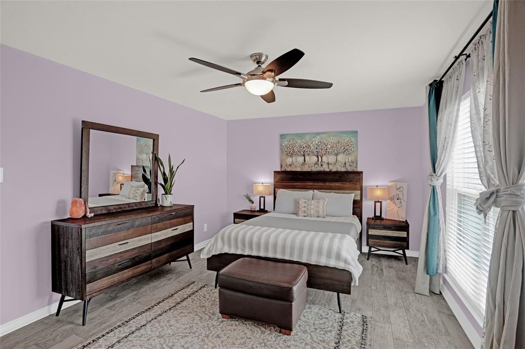12834 Midway Road, Unit 2110 Dallas, TX 75244 - Photo 14 of 22 Bedroom featuring a ceiling fan and light wood-type flooring