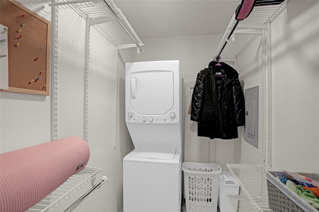 12834 Midway Road, Unit 2110 Dallas, TX 75244 - Photo 15 of 22 Laundry room with stacked washer / dryer and electric panel