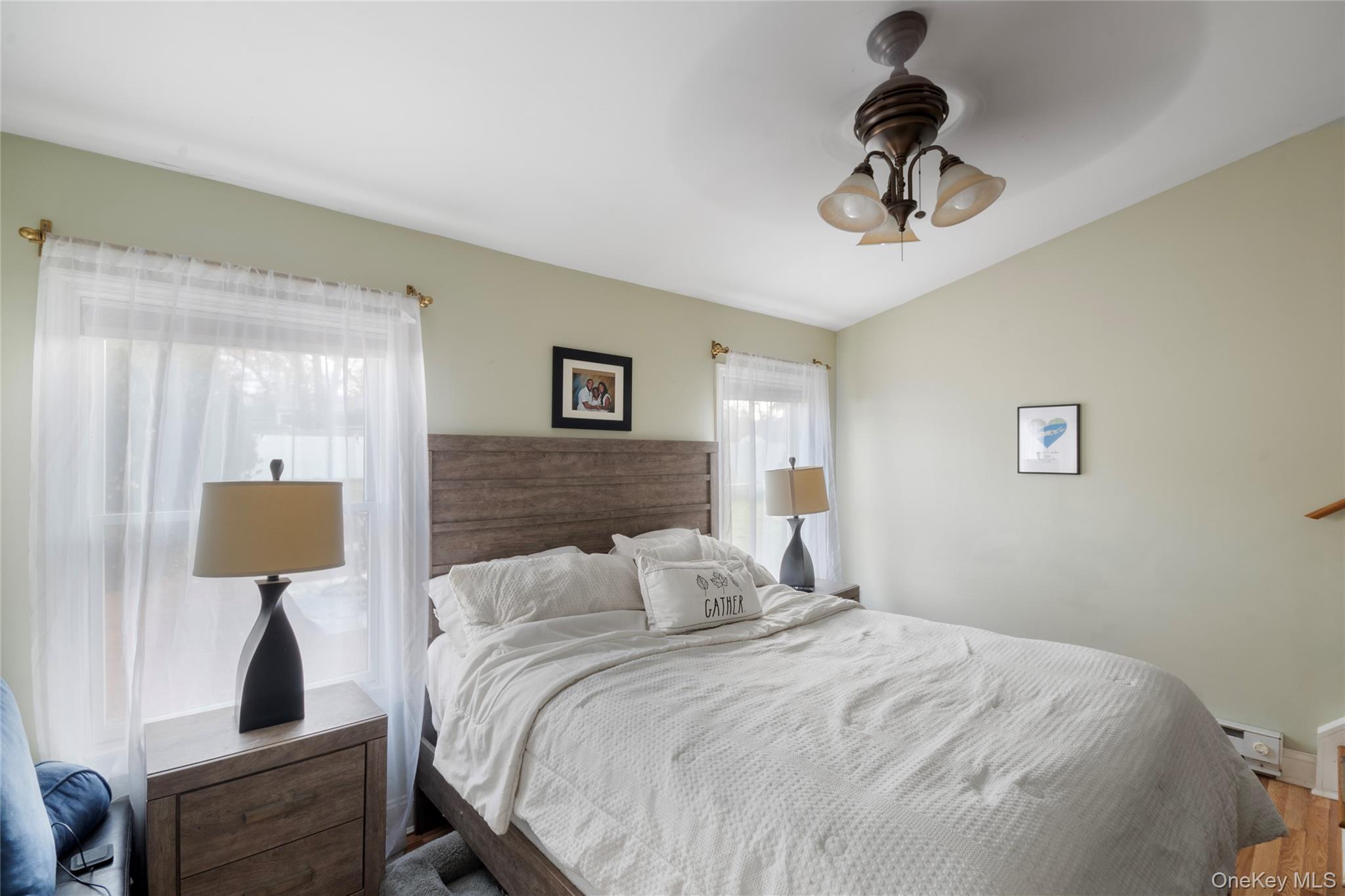 277 Horseblock Road Farmingville, NY 11738 - Photo 12 of 28 Bedroom featuring ceiling fan and wood finished floors