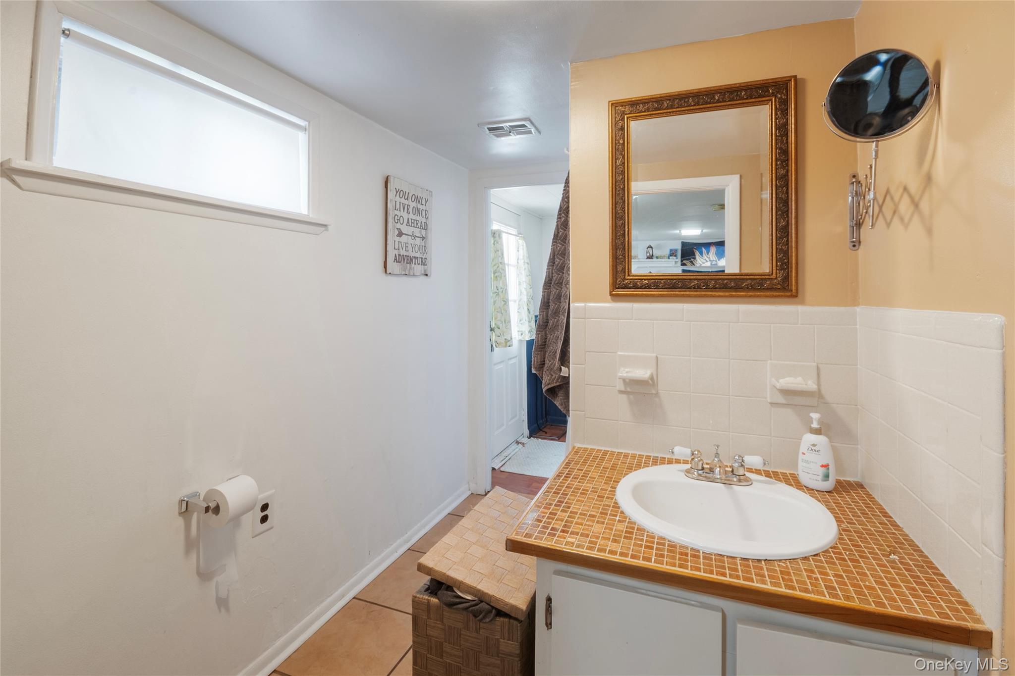 277 Horseblock Road Farmingville, NY 11738 - Photo 22 of 28 Bathroom featuring vanity and light tile patterned flooring