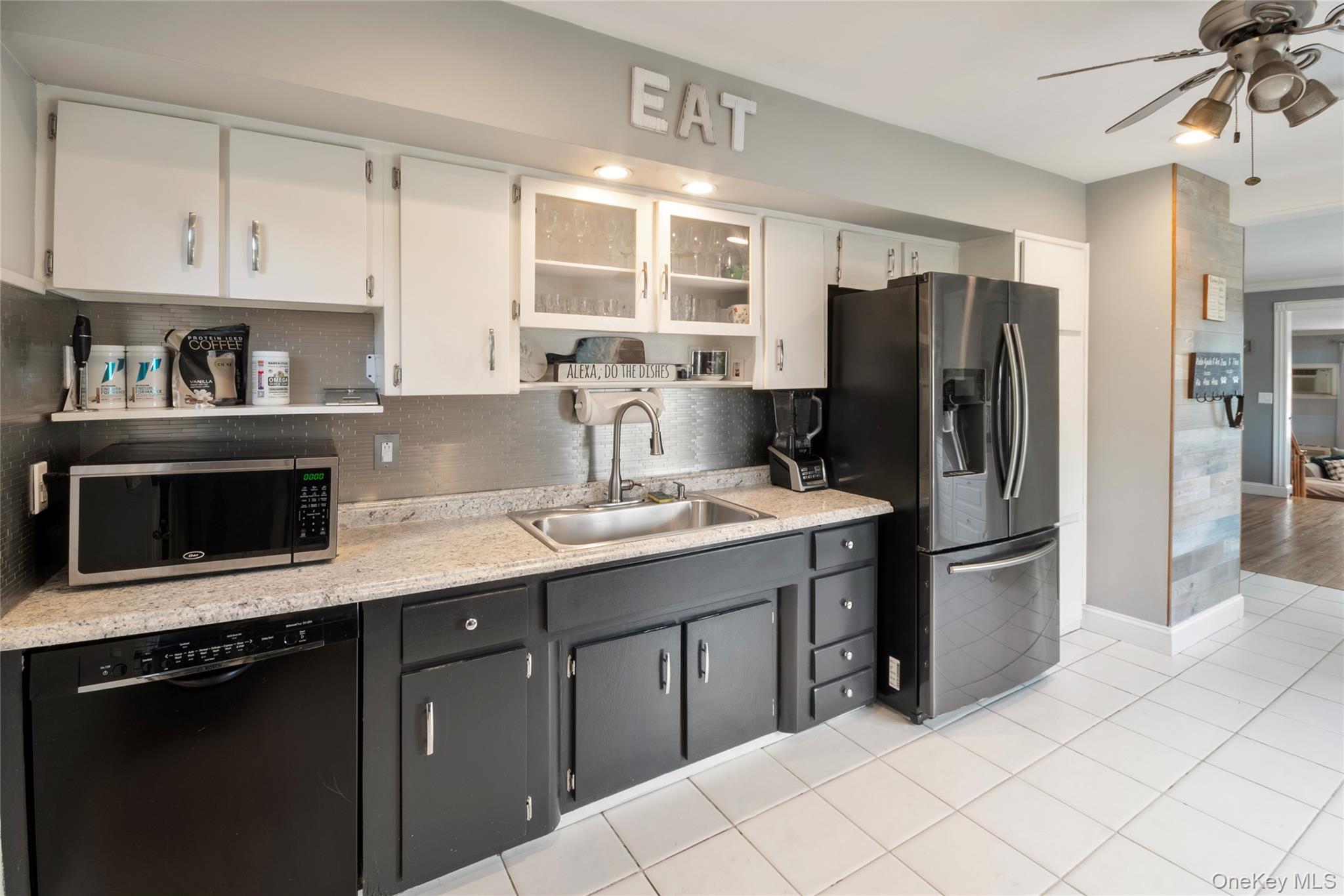 277 Horseblock Road Farmingville, NY 11738 - Photo 4 of 28 Kitchen with open shelves, white cabinetry, appliances with stainless steel finishes, decorative backsplash, and ceiling fan