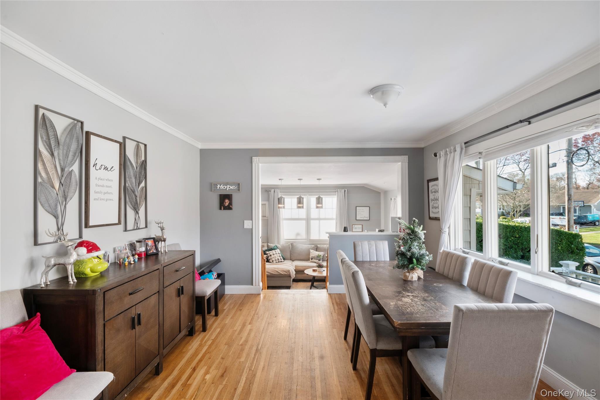 277 Horseblock Road Farmingville, NY 11738 - Photo 8 of 28 Dining area with crown molding and light wood-type flooring