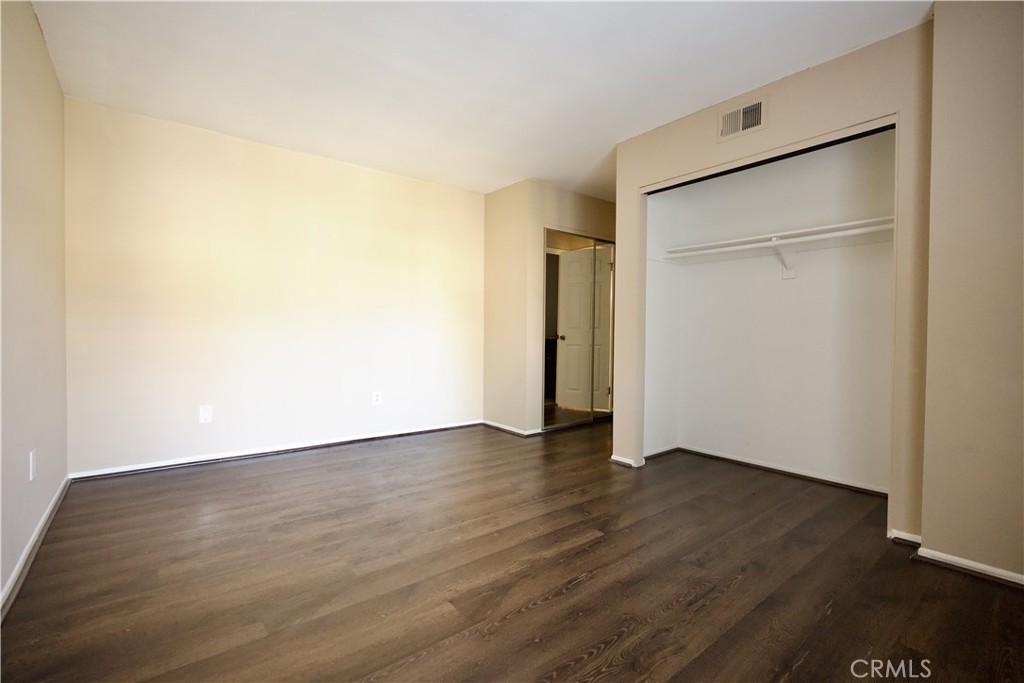 407 Tangelo Irvine, CA 92618 - Photo 15 of 30 an empty room with wooden floor and a window