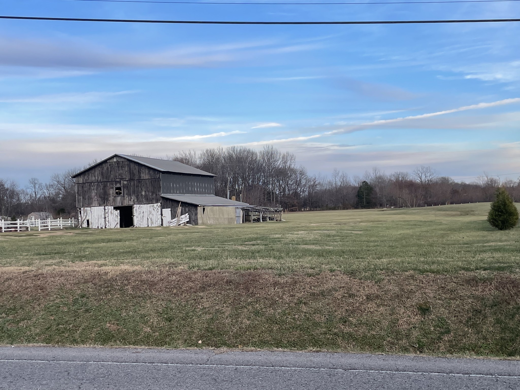 805 Jackson Road Portland, TN 37148 - Photo 2 of 11 a view of a big house in a big yard with large trees