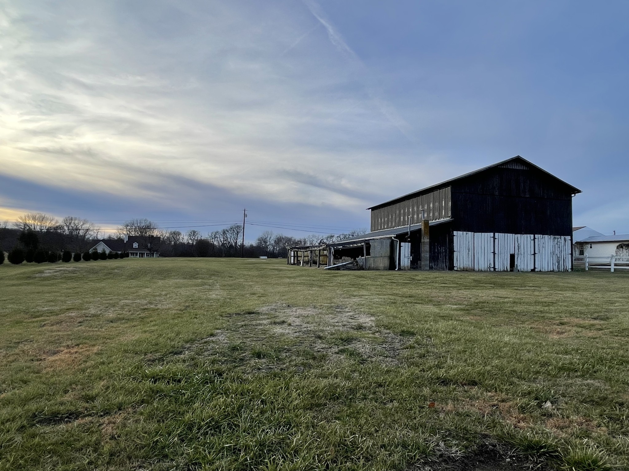 805 Jackson Road Portland, TN 37148 - Photo 7 of 11 a front view of a house with a yard and trees