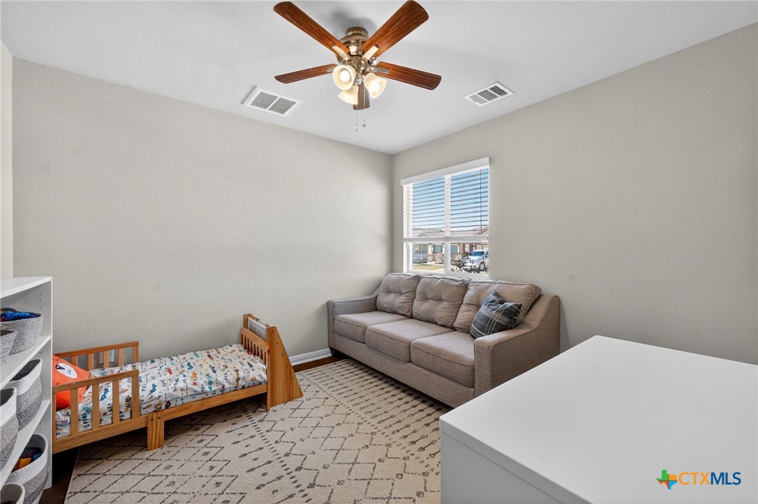201 Cane River Road Pflugerville, TX 78660 - Photo 14 of 21 a living room with furniture and a window