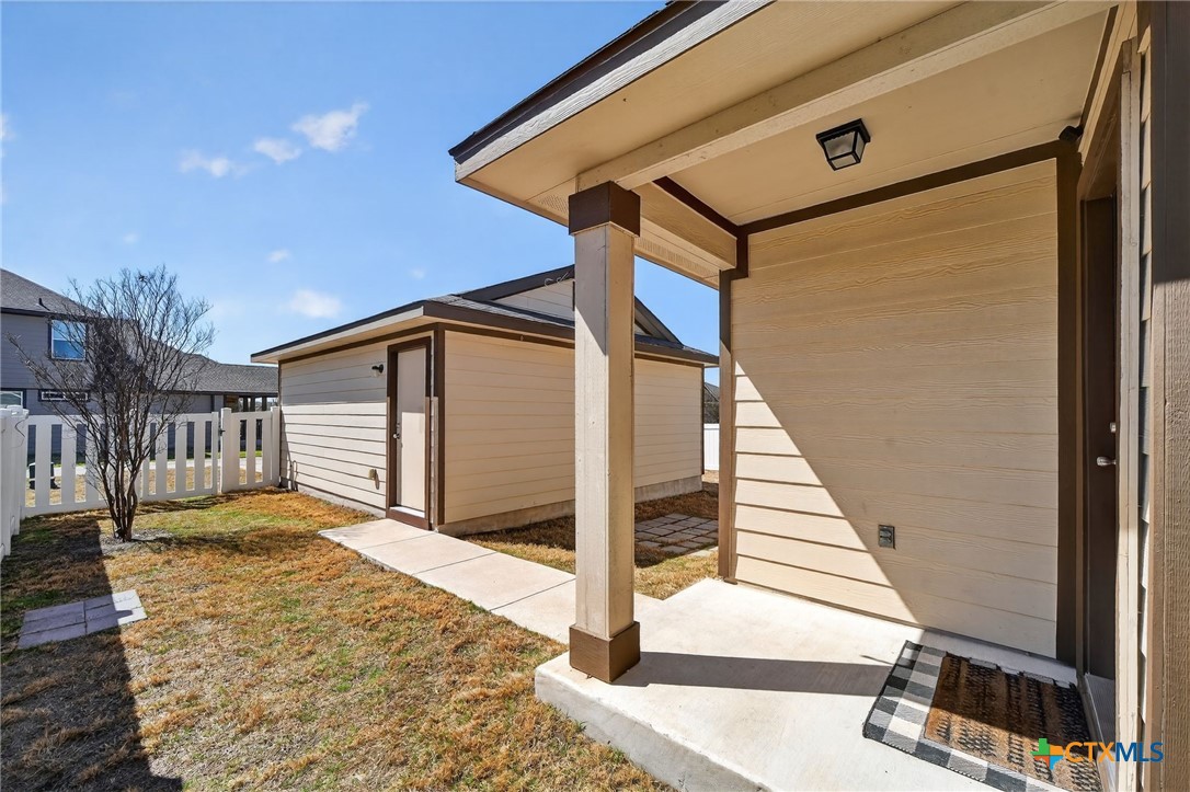 201 Cane River Road Pflugerville, TX 78660 - Photo 15 of 21 a view of a house with wooden fence