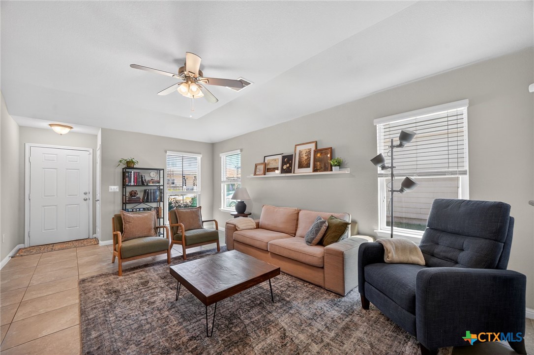 201 Cane River Road Pflugerville, TX 78660 - Photo 21 of 21 a living room with furniture and a rug