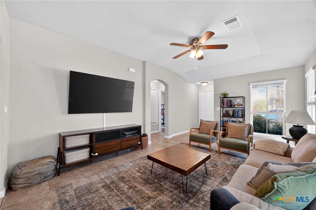 201 Cane River Road Pflugerville, TX 78660 - Photo 7 of 21 a living room with furniture and a flat screen tv