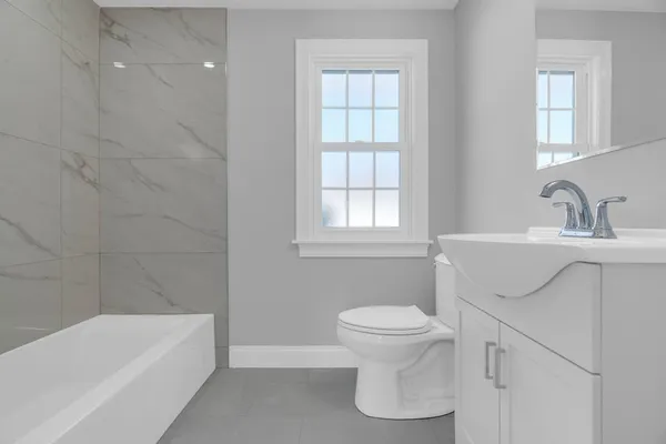 a bathroom with a sink toilet and bathtub