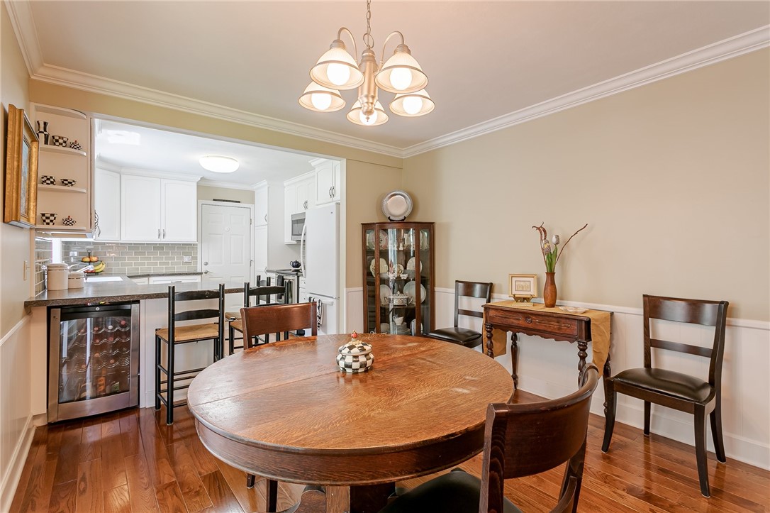 2024 Baird Road Penfield, NY 14526 - Photo 18 of 37 Notice the wine cooler beneath the convenient isla