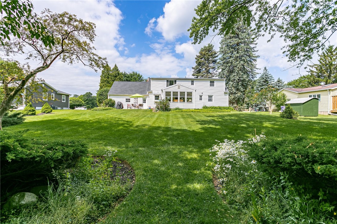 2024 Baird Road Penfield, NY 14526 - Photo 36 of 37 Beautifully landscaped rear yard!