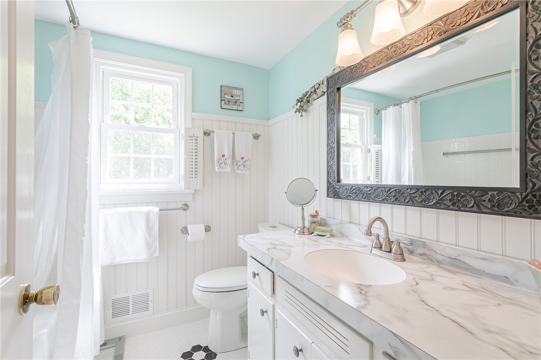 2024 Baird Road Penfield, NY 14526 - Photo 7 of 37 Light and bright full upstairs bathroom.