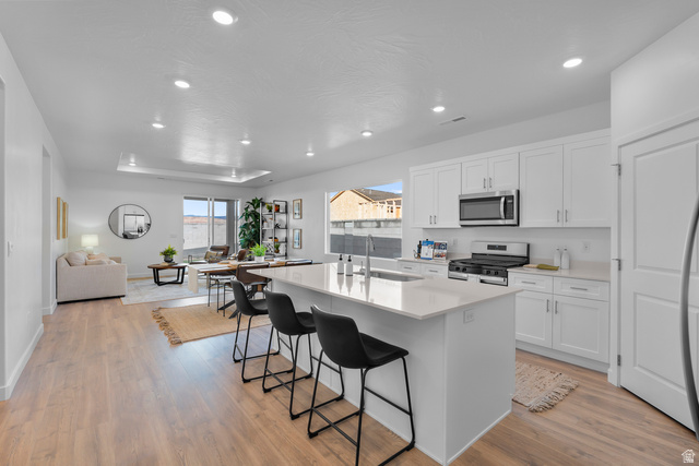 1589 South Fins Road, Unit 4178 Washington, UT 84780 - Photo 10 of 30 Open-concept kitchen and living area featuring wood-finish flooring